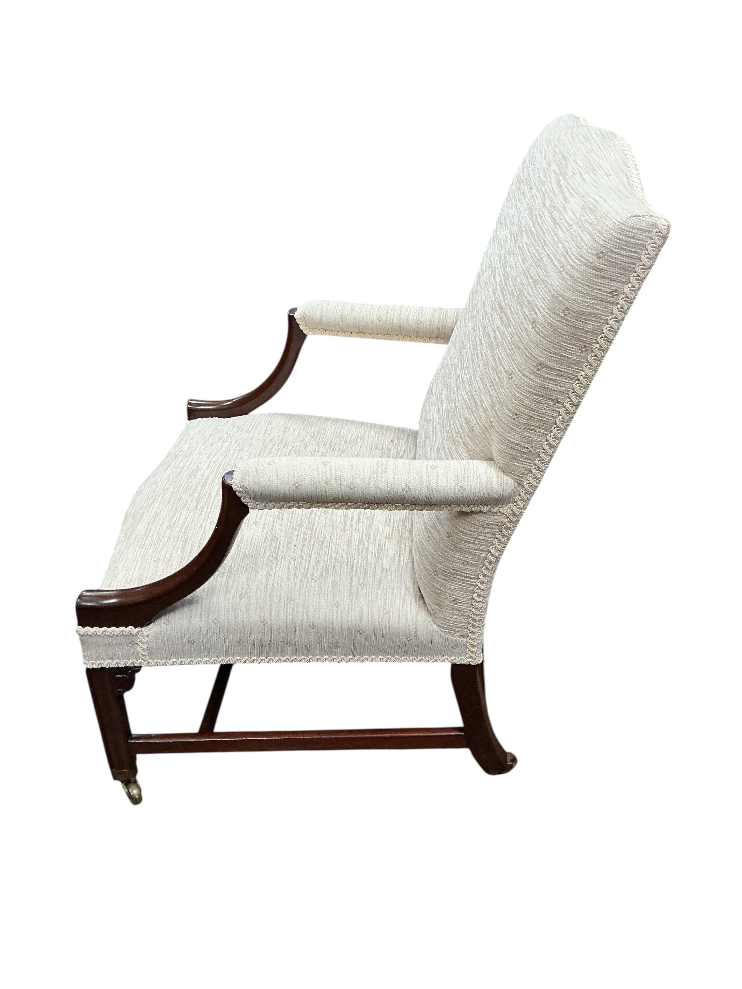 A George III and later Gainsborough type mahogany armchair, width 62cm, depth 65cm, height 96cm